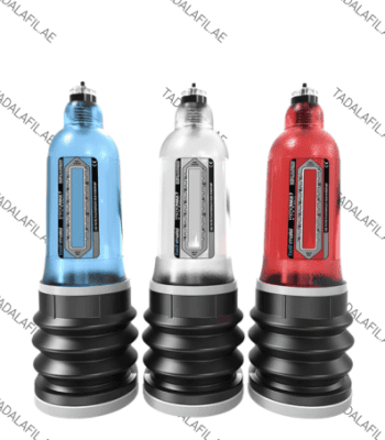 Three male enhancement pump devices in blue, silver, and red colors displayed on a white background.